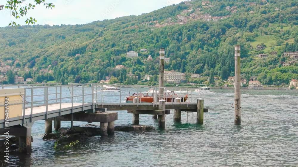 Lake pier tourist boat. Scenic view, nature and town. Lake pier tourist boat. Scenic view, nature and town.