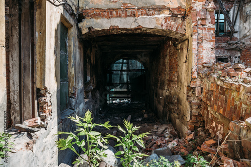 Old abandoned red brick house ruin  damaged by earthquake  war or other natural disaster  demolished decay debris