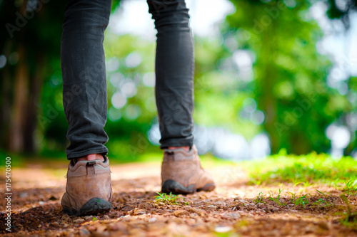 Man traveler traveling walking with backpack at the jungle on holiday at weekend on background nature view