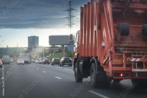 Red Garbage Truck on the city road