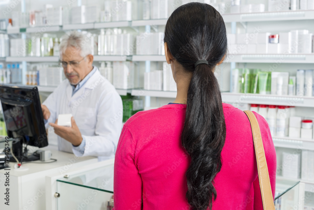 Woman With Brown Hair Standing In Pharmacy Woman With Brown Hair Standing In Pharmacy
