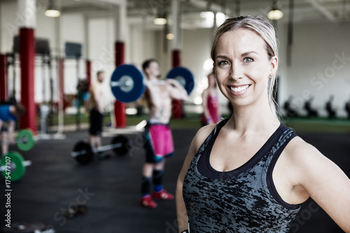 Woman Smiling In Gym © Tyler Olson