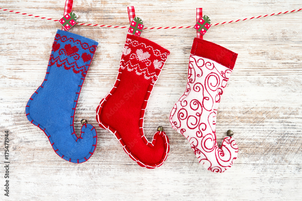 Christmas background. Colorful Christmas socks on wooden background