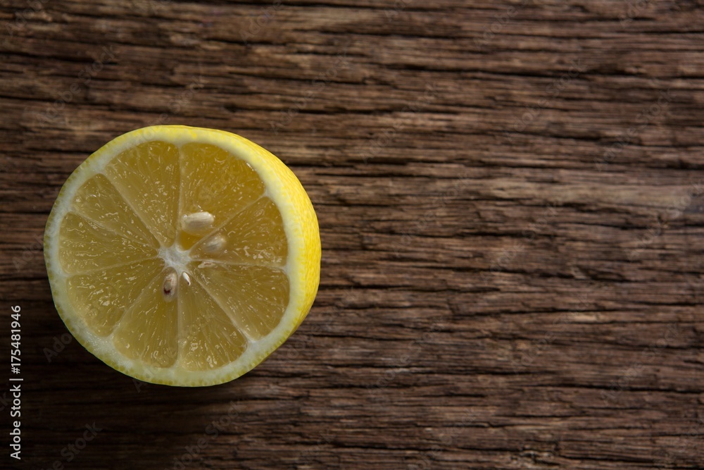 Halved lemon on wooden table Halved lemon on wooden table