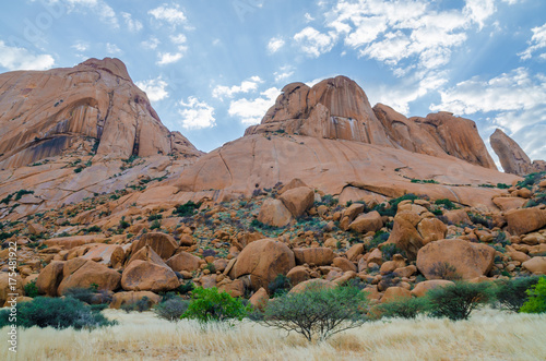 Landscape with famous red Spitzkoppe mountain and dramatic sky, Damaraland, Namibia, Southern Africa