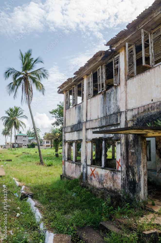 Abandoned and fading house in Robertsport, traces of civil war, Liberia, West Africa Abandoned and fading house in Robertsport, traces of civil war, Liberia, West Africa