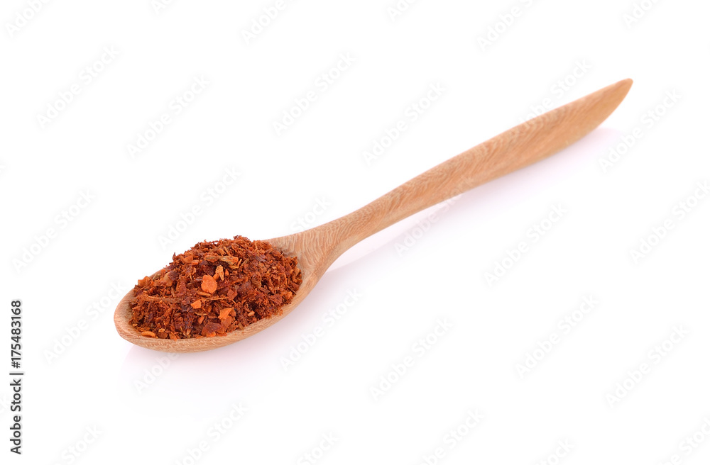 wood spoon of cayenne pepper isolated on white background wood spoon of cayenne pepper isolated on white background