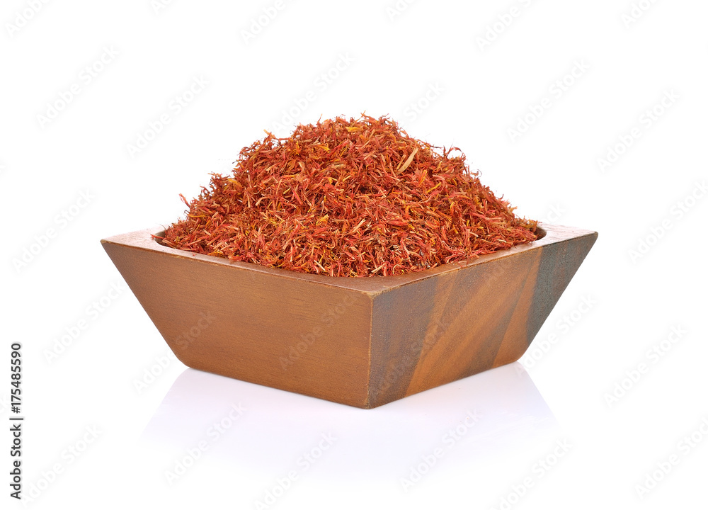 Safflower in a bowl on white background Safflower in a bowl on white background