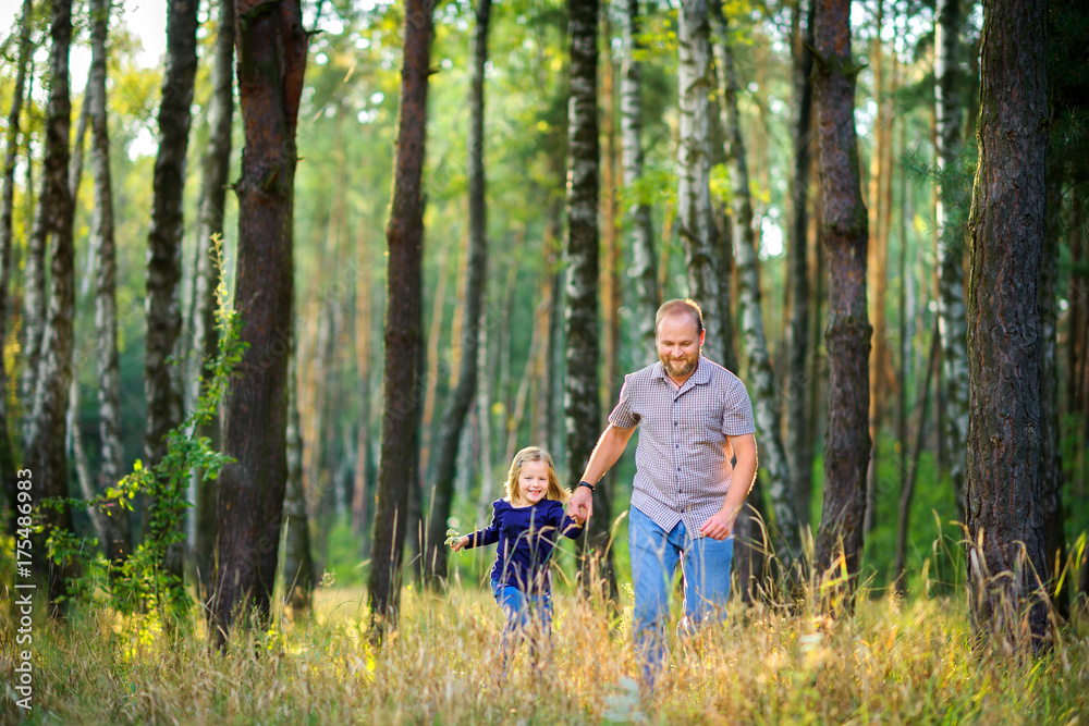 dad walks in the park with his beloved daughter, run and have fun dad walks in the park with his beloved daughter, run and have fun