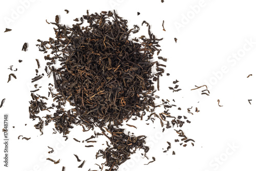 Dry black tea leaves isolated on white