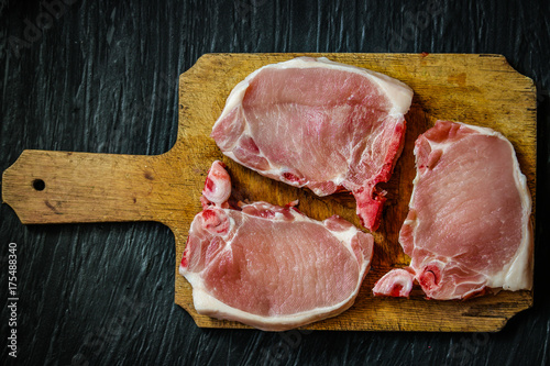 Pork steak raw on a kitchen cutting board