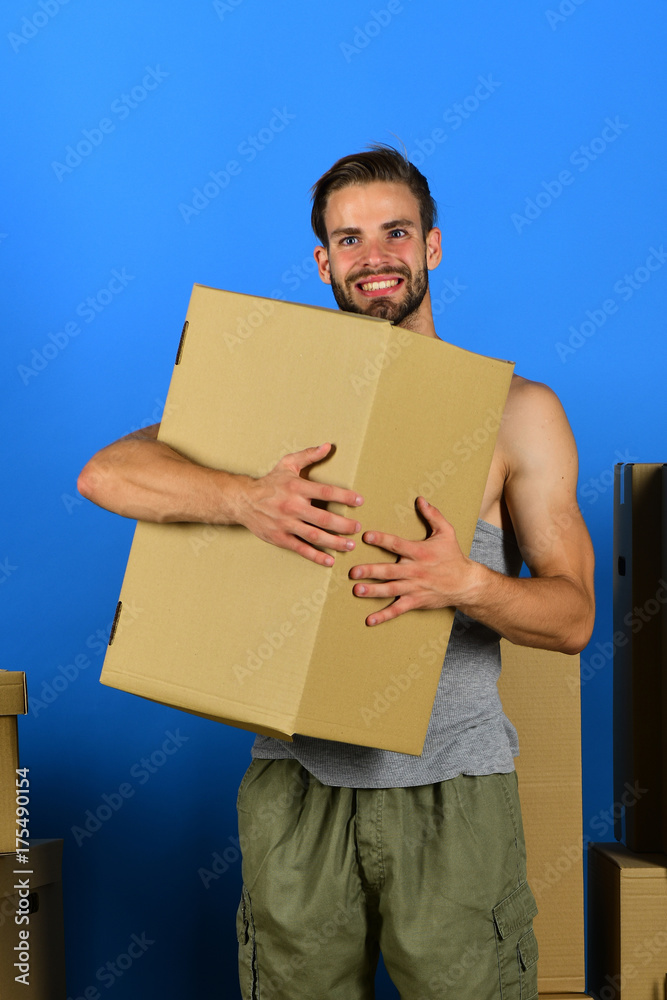 Guy hugging carton and smiling Guy hugging carton and smiling