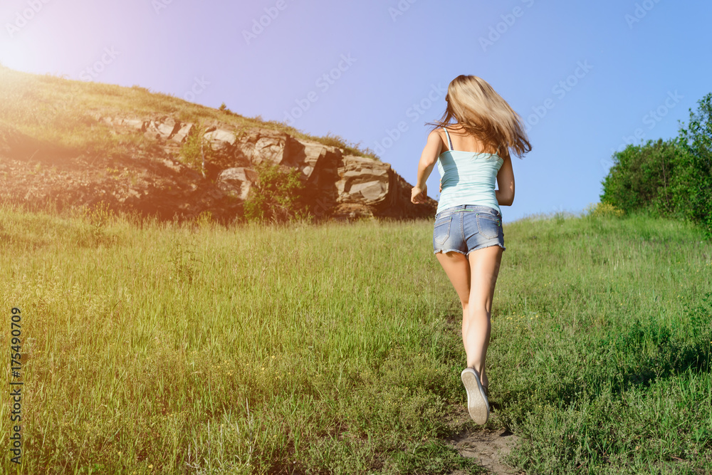beautiful happy girl dressed on country style Runs off the path