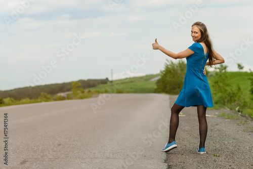 Pretty young girl catches a ride on the highway