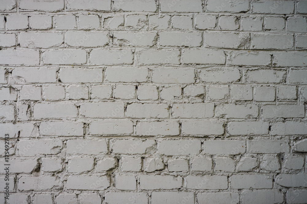 Fototapeta premium The texture of the wall of bricks painted white