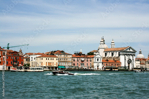 Boats and motor boats in the Giudecca Canal in the Italian city of Venice