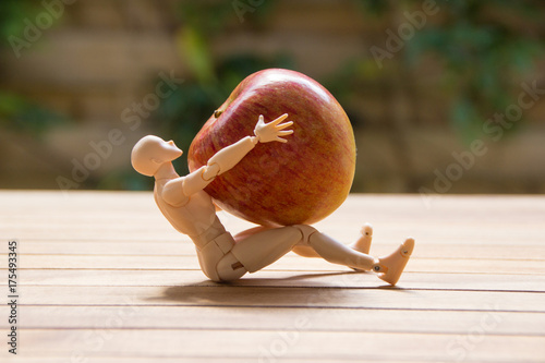Man holding a huge apple