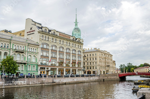Moyka River with the Red Bridge and the department store Au Pont Rouge in Saint Petersburg, Russia