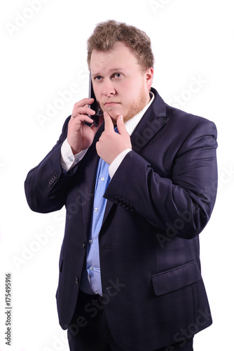 Portrait of businessman while talking on mobile phone. isolated on White background