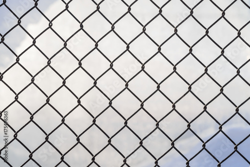 Wire mesh cage with blurry background