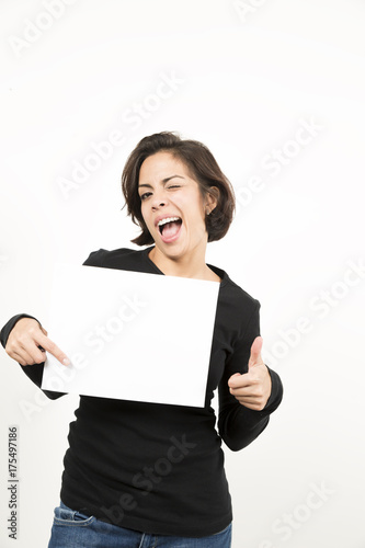 Beautiful young woman holding a blank sheet of paper