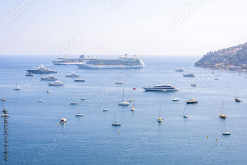 Beautiful daylight view to boats and ships on water in luxury resort villefranche sur mer and bay on french riviera at mediterranean sea Cote d'Azur in France.