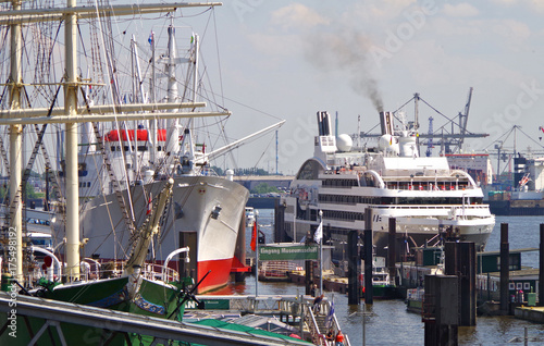 Luxury cruise ship yacht Ponant Expeditions Le Boreal at Port of Hamburg in Germany with historic museum ship Cap San Diego photo