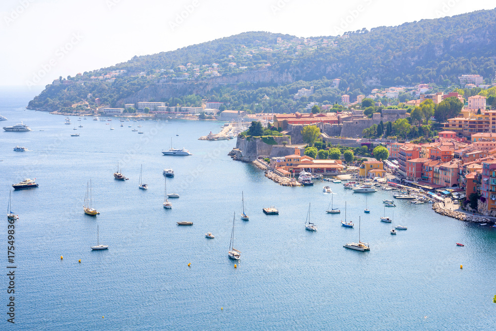 Beautiful daylight view to boats and ships on water in luxury resort villefranche sur mer and bay on french riviera at mediterranean sea Cote d'Azur in France.