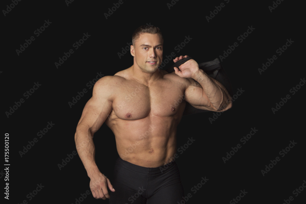 Strong Man With Sports Bag on Black on Black