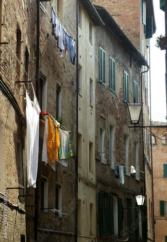 No tourists, a narrow street in Siena with Italian laundry