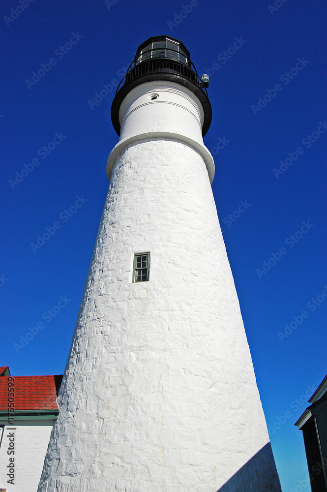 Portland Head Lighthouse and keepers' house in summer, Cape Elizabeth, Maine, USA.