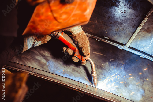 Metal Welding with sparks and smoke photo