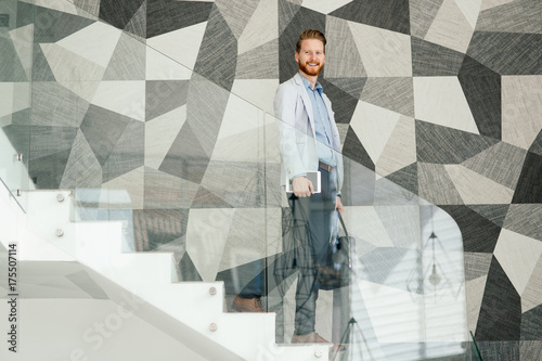 Wallpaper Mural Businessman having tablet and phone at hand Torontodigital.ca
