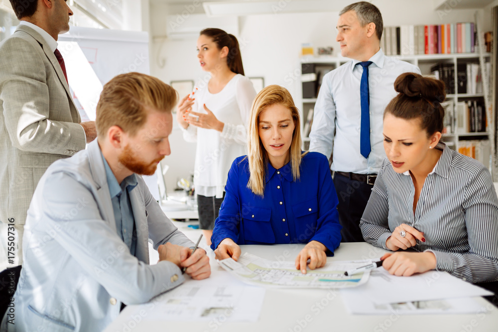 Businesspeople collaborating in office Businesspeople collaborating in office