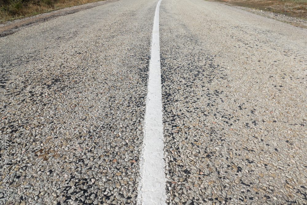 Naklejka premium Country road outside of city / Asphalt road with white dividing strip
