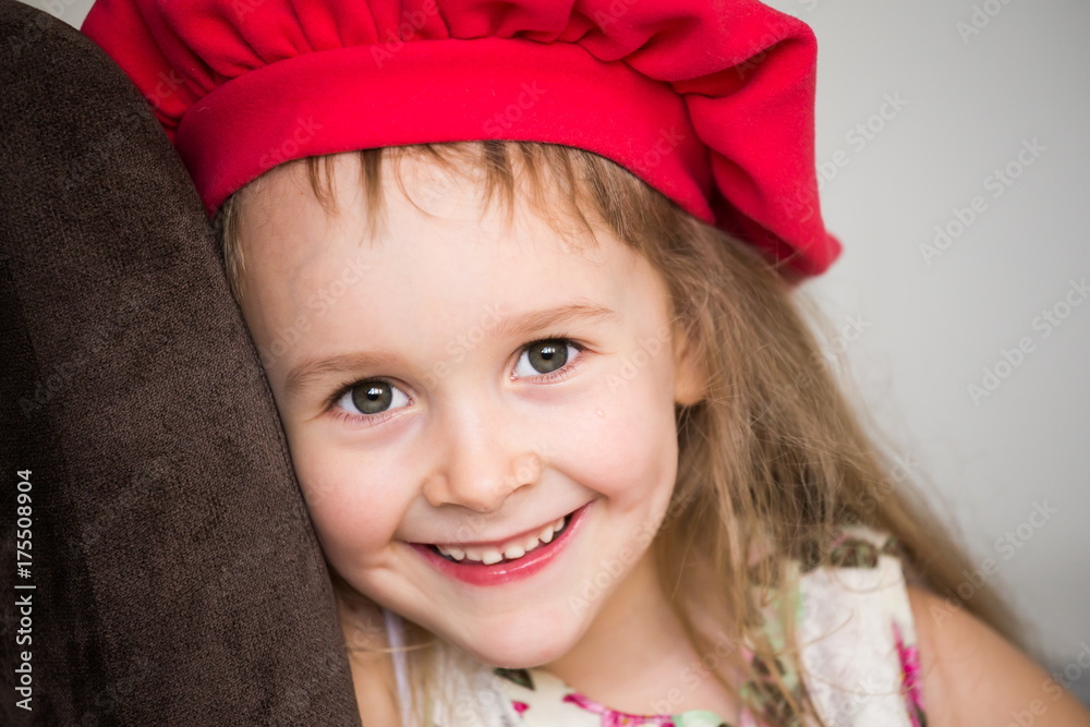 little girl face, red hat, fun, close up little girl face, red hat, fun, close up