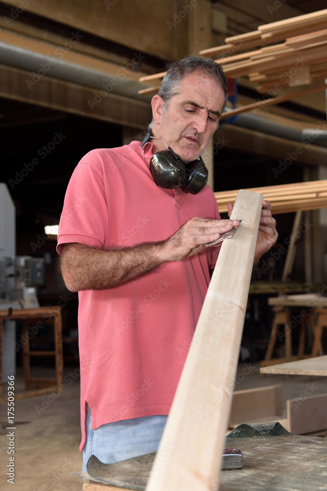 a carpenter working in his workshop