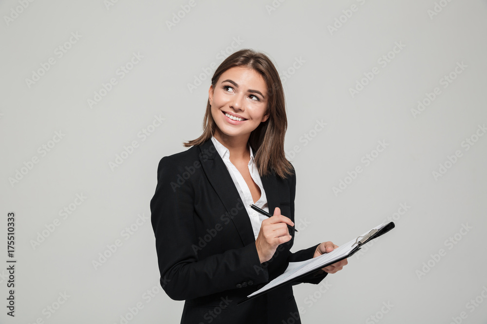 Portrait of a smiling young businesswoman in suit Portrait of a smiling young businesswoman in suit