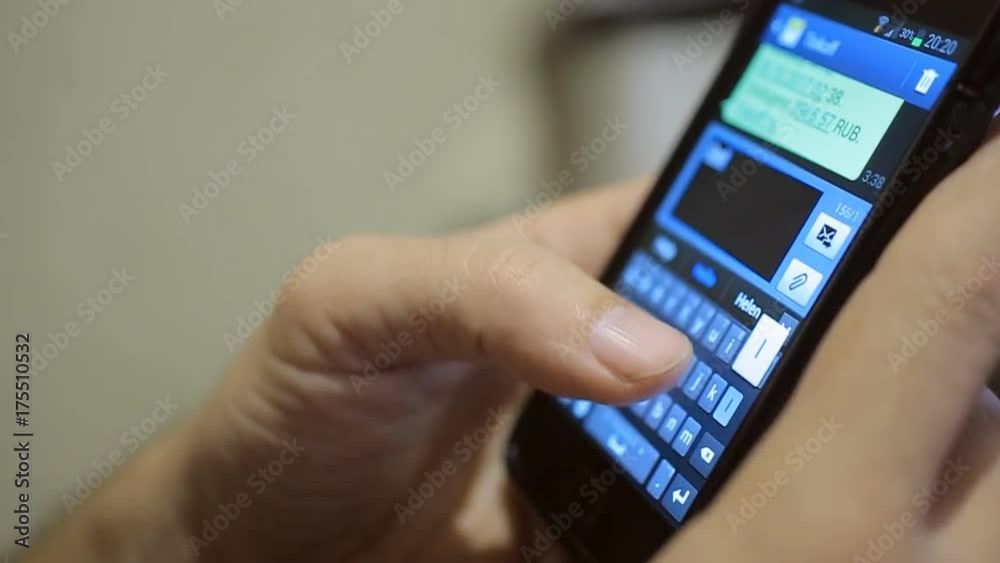 Hand writing sms on touch screen smartphone, closeup Hand writing sms on touch screen smartphone, closeup