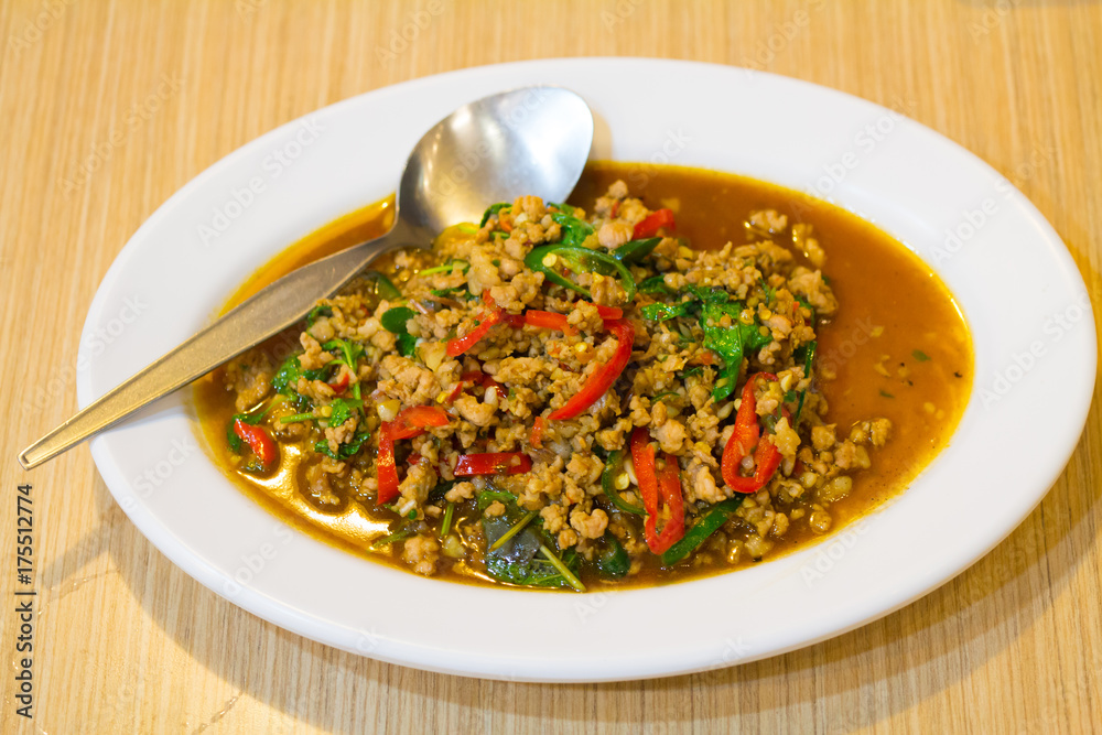 stir-fried with minced pork and basil on white plate (Ka Prao Moo) stir-fried with minced pork and basil on white plate (Ka Prao Moo)