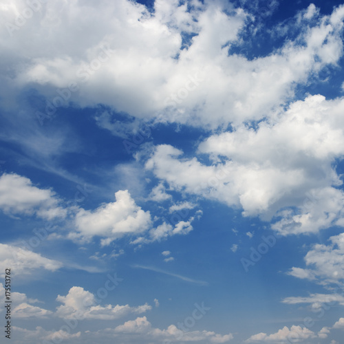 Cumulus white clouds on a blue sky background