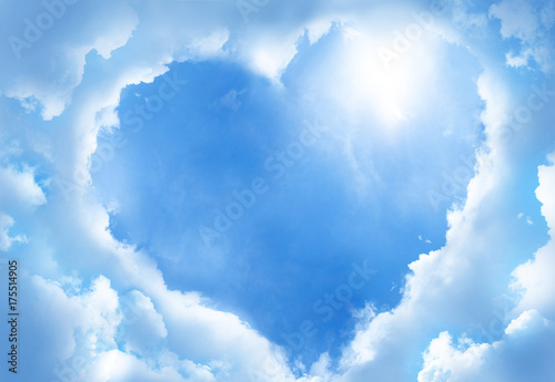 Fototapeta Naklejka Na Ścianę i Meble -  Heart frame shaped clouds on sky background.