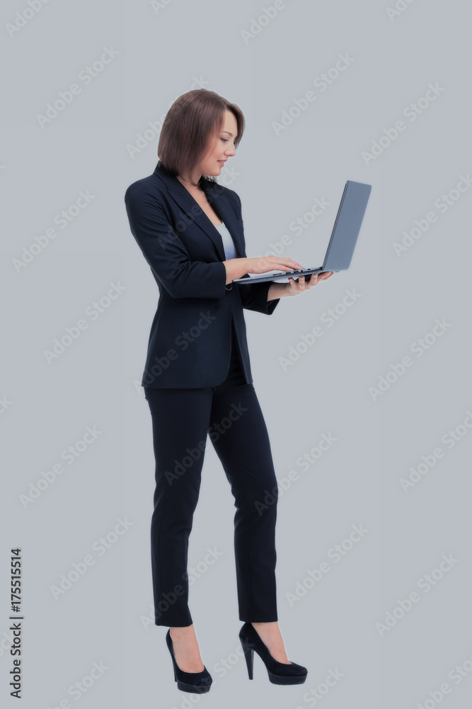 Beautiful businesswoman keeps the laptop. Beautiful businesswoman keeps the laptop.