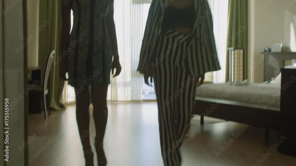 Two models parade in the hotel number