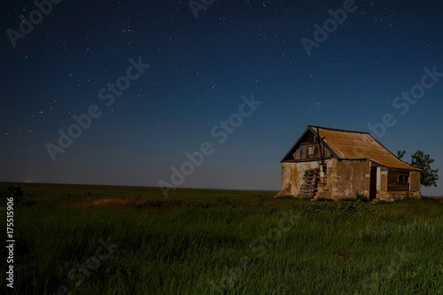 Night landscape with abandoned spooky house © Yakov