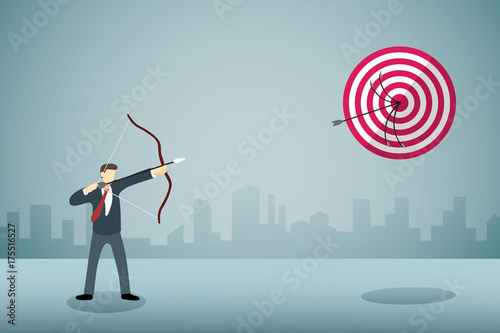 Businessman shoting arrow bow to arrow target in sane point with propessionnal skill.