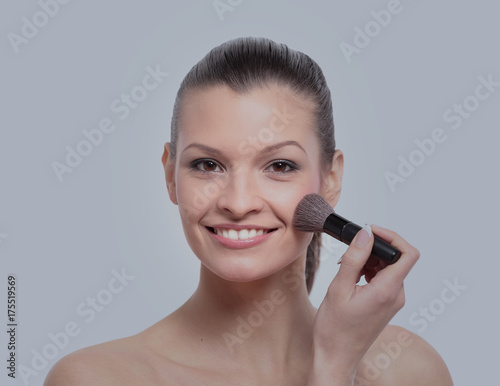 Young girl apply makeup