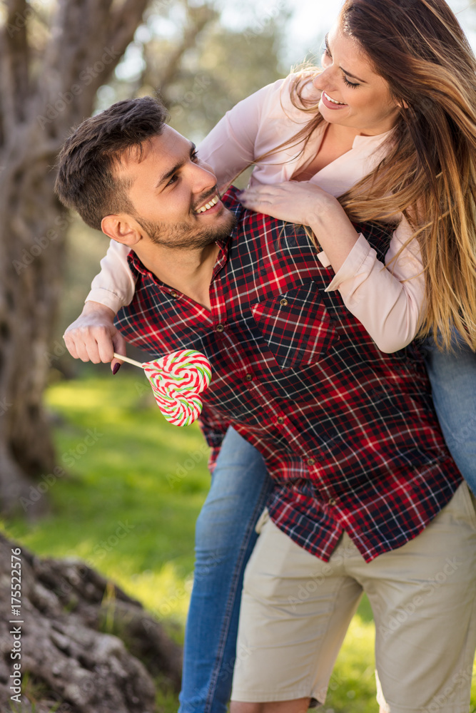 Portrait of a happy young couple in the nature hugged together Portrait of a happy young couple in the nature hugged together