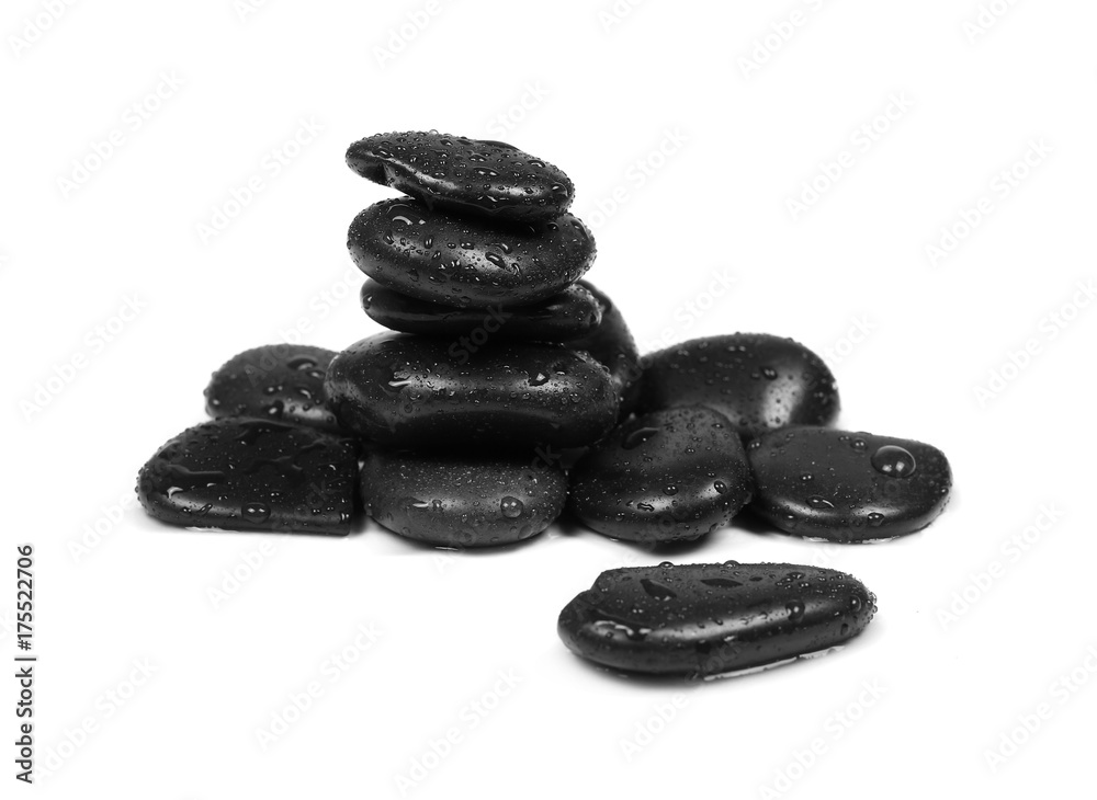 Black spa stones with water drops isolated on white background Black spa stones with water drops isolated on white background