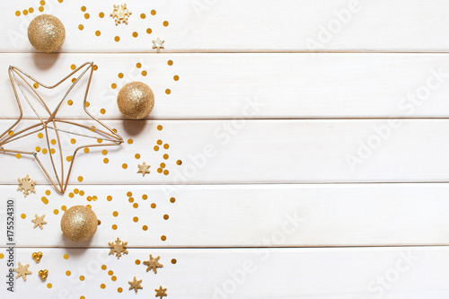 White wooden holiday background with golden decoration